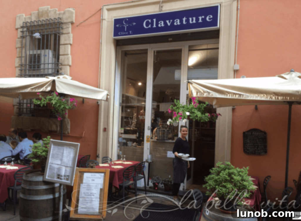 Creamy Panna Cotta with Vibrant Strawberry Coulis 5 Clavature restaurant entrance in Bologna