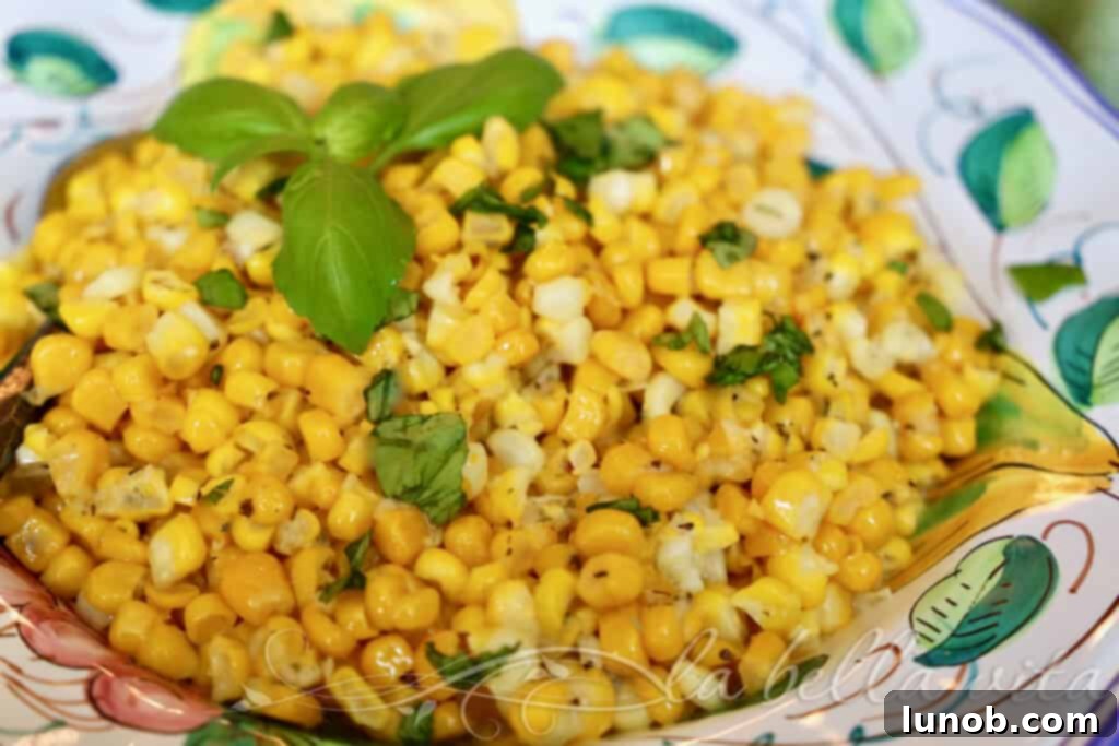 Close-up of Cheesy Pecorino Corn with Italian Herbs in a bowl.