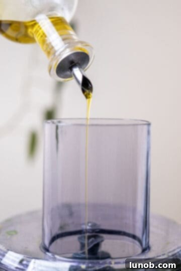 Artisan Pistachio Pesto 6 oil poured in food processor