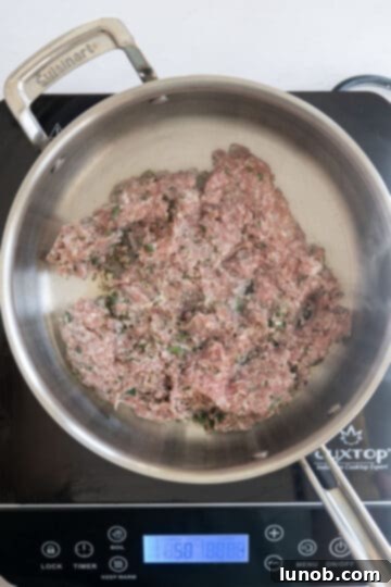Rustic Sausage and Fennel Pasta 3 Ground Italian sausage being seared in a hot pan to develop a crust.