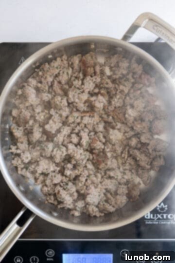 Rustic Sausage and Fennel Pasta 4 Browned ground Italian sausage broken apart in a pan after searing.