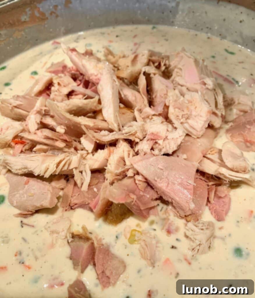 Turkey Tetrazzini: Cheesy Italian Delight with Crispy Garlic Butter Topping 18 Adding chopped or shredded turkey to the creamy Tetrazzini sauce