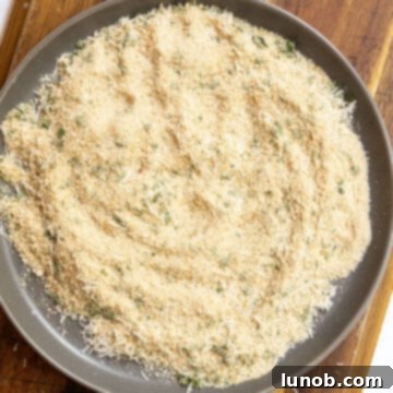 Seasoned breadcrumbs on a plate.