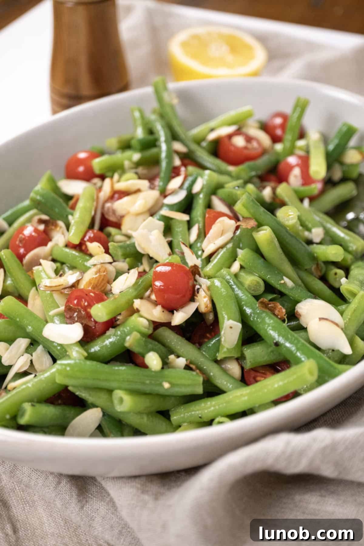 Finished Italian green bean salad with fresh herbs and a vibrant dressing