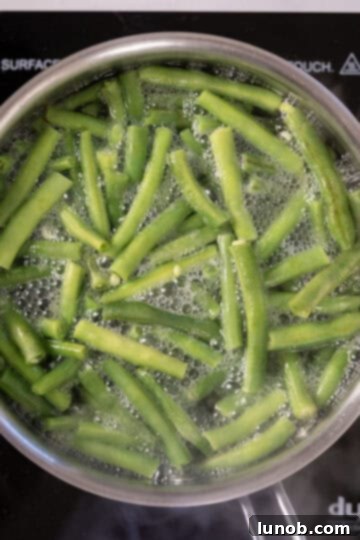 Blanching fresh green beans in boiling water