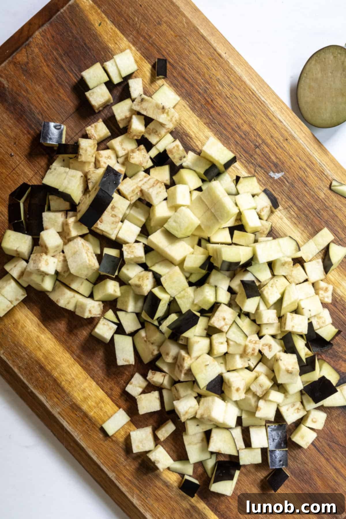 Finely chopped eggplant, salted and ready for cooking