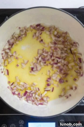 Sauteed red onion gently cooking in olive oil
