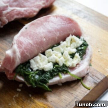 Smoky Grilled Stuffed Pork Chops 7 Raw butterflied pork chop stuffed with sauteed spinach and feta.