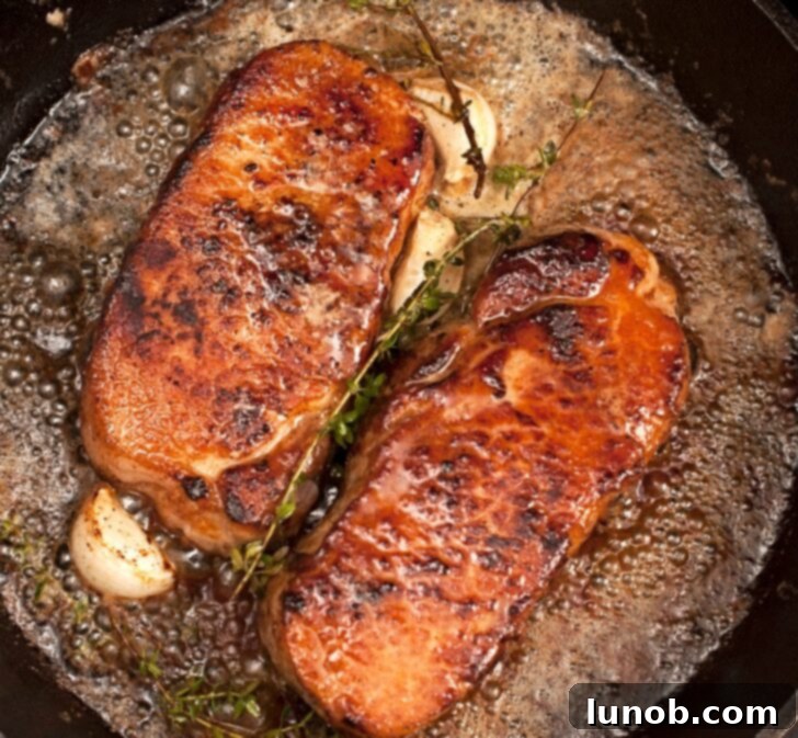 Keto Garlic Butter Herb Pork Chops 2 Pork Chops in Garlic Butter Sauce