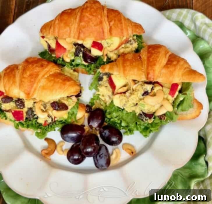 Freshly prepared Curry Chicken Salad with grapes, apples, and cashews, ready to be served.