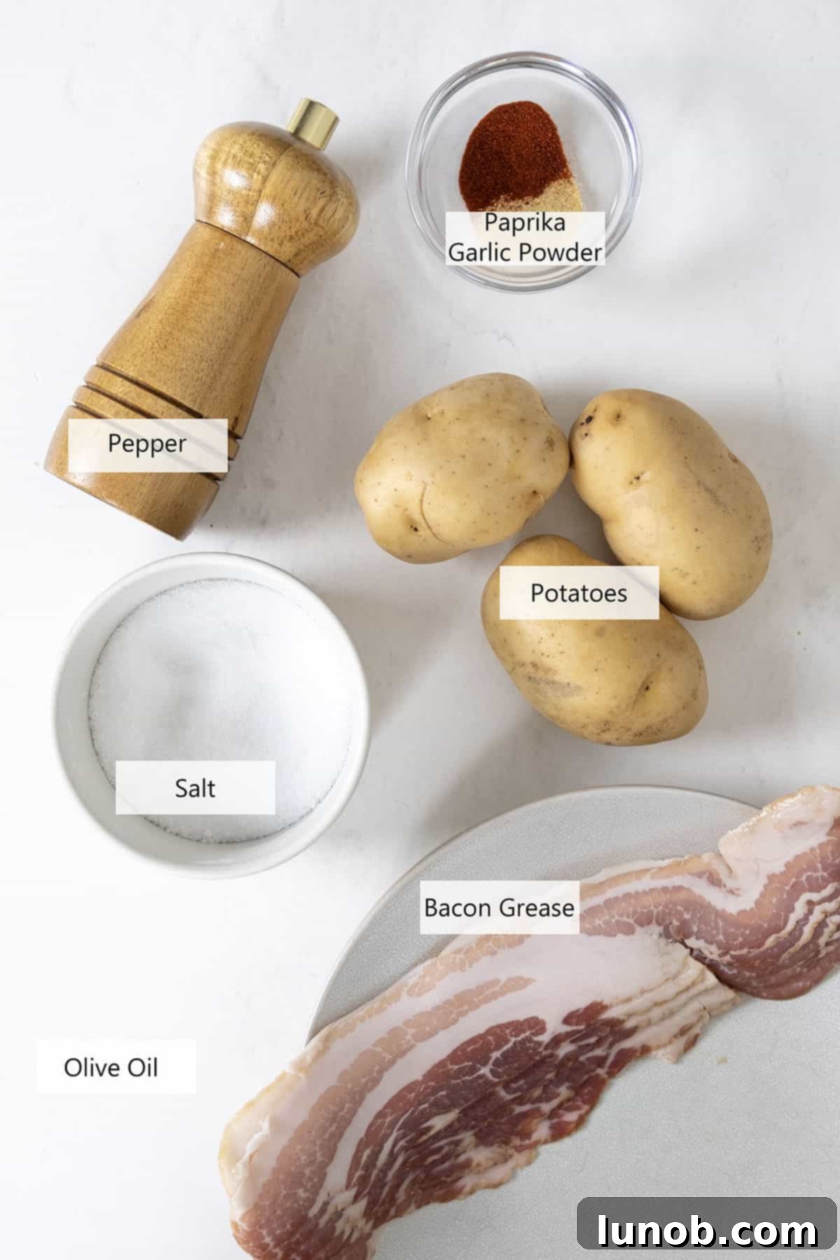 Ingredients for the crispy hash browns recipe laid out on a table.