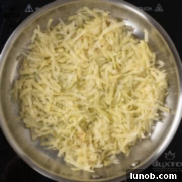 Frying potatoes in a single thin layer in a hot frying pan.