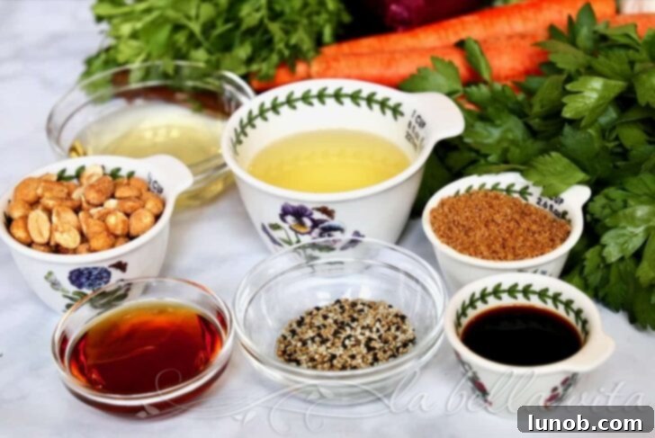 A bowl of freshly chopped Asian Chopped Salad ready to be dressed, showing various vegetables and nuts.