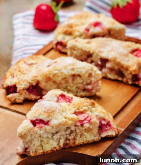 A perfectly baked Strawberry Ricotta Scone, golden brown and inviting.