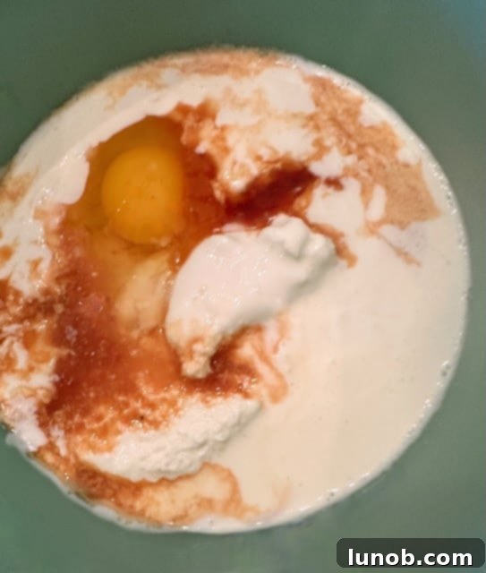 Wet ingredients for scones mixed in a bowl.