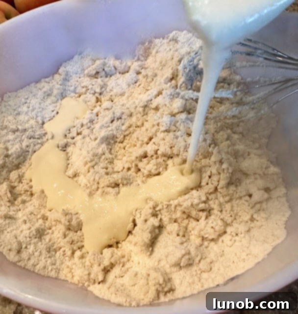 Wet and dry scone ingredients partially mixed.