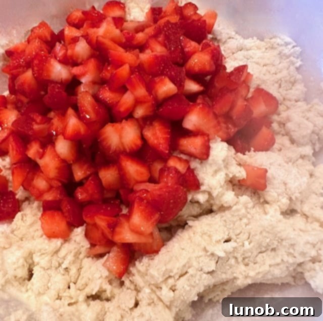 Strawberry pieces added to the scone dough.