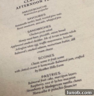 A three-tiered serving tray showcasing delicious afternoon tea treats.