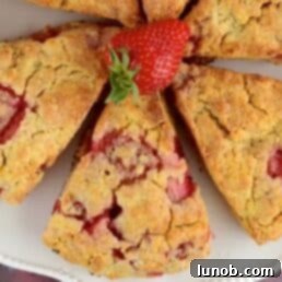 Beautifully baked strawberry ricotta scones on a cooling rack, ready to be served.