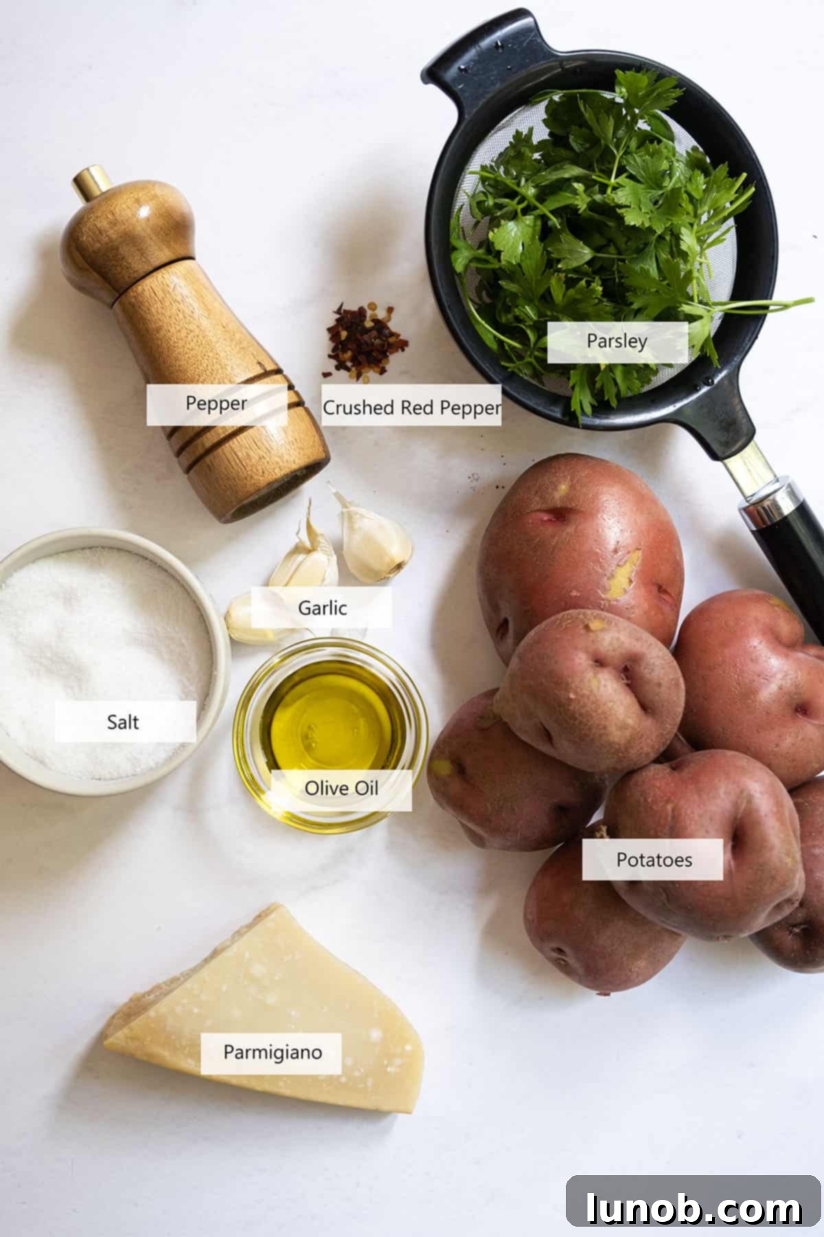 Ultimate Crispy Garlic Parmesan Potatoes 3 Ingredients for the potatoes, including red potatoes, garlic, olive oil, and seasonings.