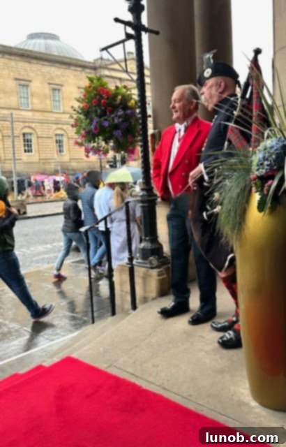Balmoral Palm Court's Exquisite Afternoon Tea 27 Scottish bagpiper playing outside The Balmoral Hotel