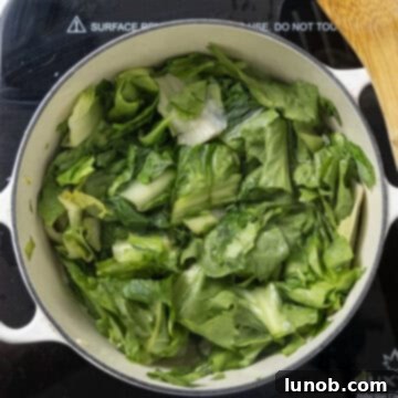 Escarole sauteing in the dutch oven.