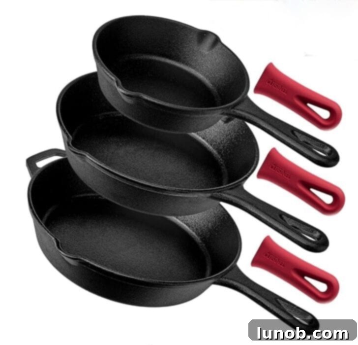 A set of three pre-seasoned cast iron skillets with silicone hot pads.