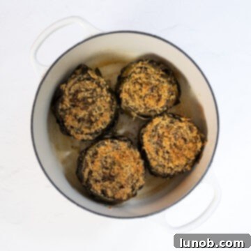 Steamed and broiled stuffed artichokes in a Dutch oven with crispy breadcrumbs.