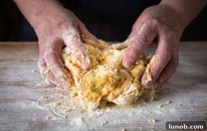 Gnocchi dough ball on a floured surface.