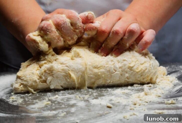 Gentle kneading of gnocchi dough.