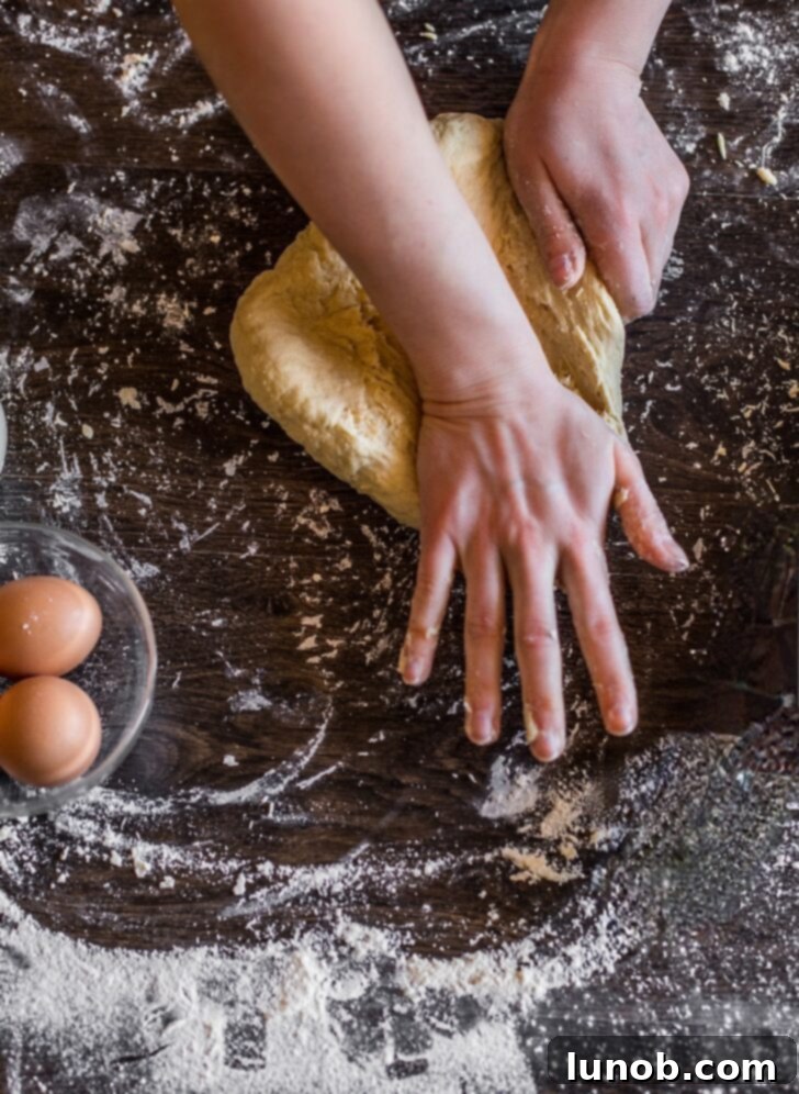 Close-up of dough kneading.