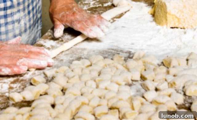 Rolling gnocchi dough into a rope.