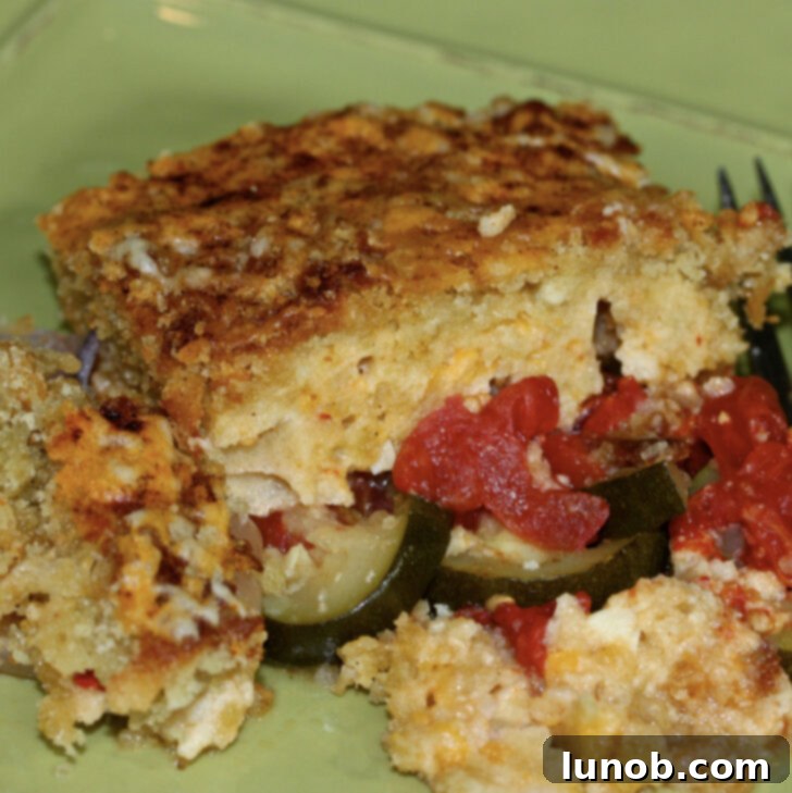 A dish of zucchini gratin with Asiago and pimento cheese.