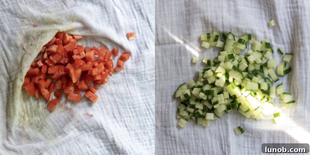 Finely chopped cucumber and tomato being drained using a cheesecloth to remove excess liquid.