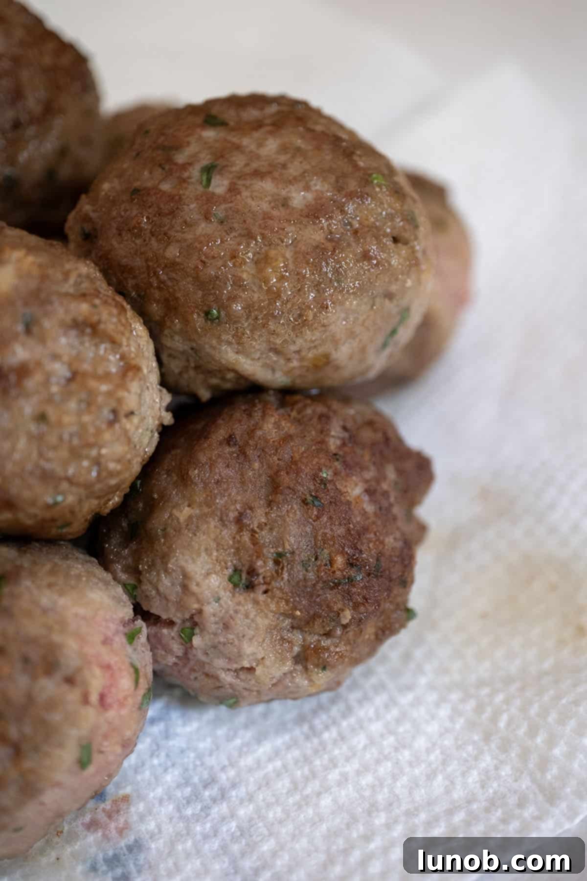 Pile of fried meatballs showing crispy texture.