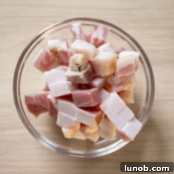 Pancetta neatly chopped into small ¼-inch squares, ready for cooking.