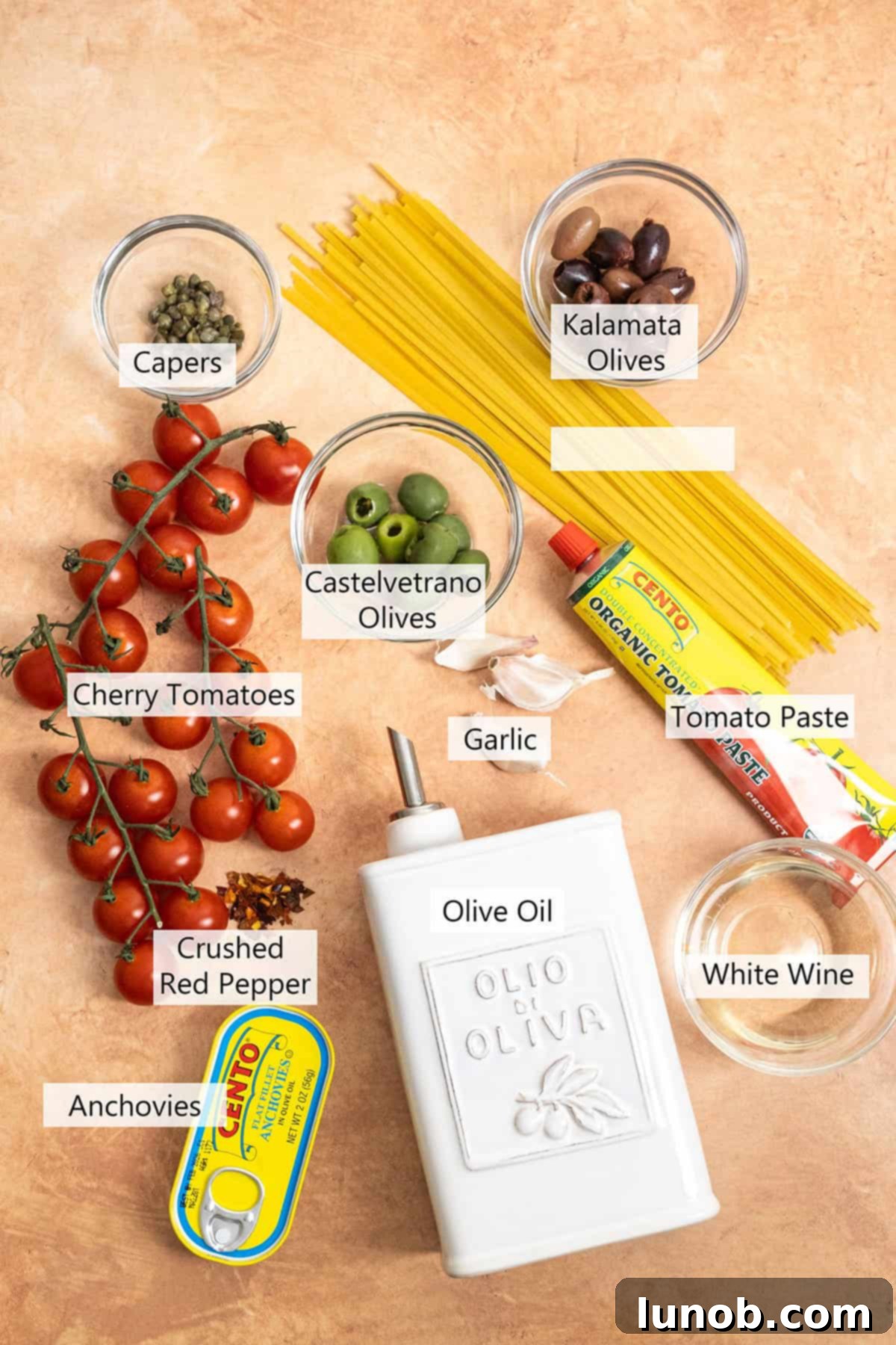 Essential ingredients laid out for making Linguine Alla Puttanesca.