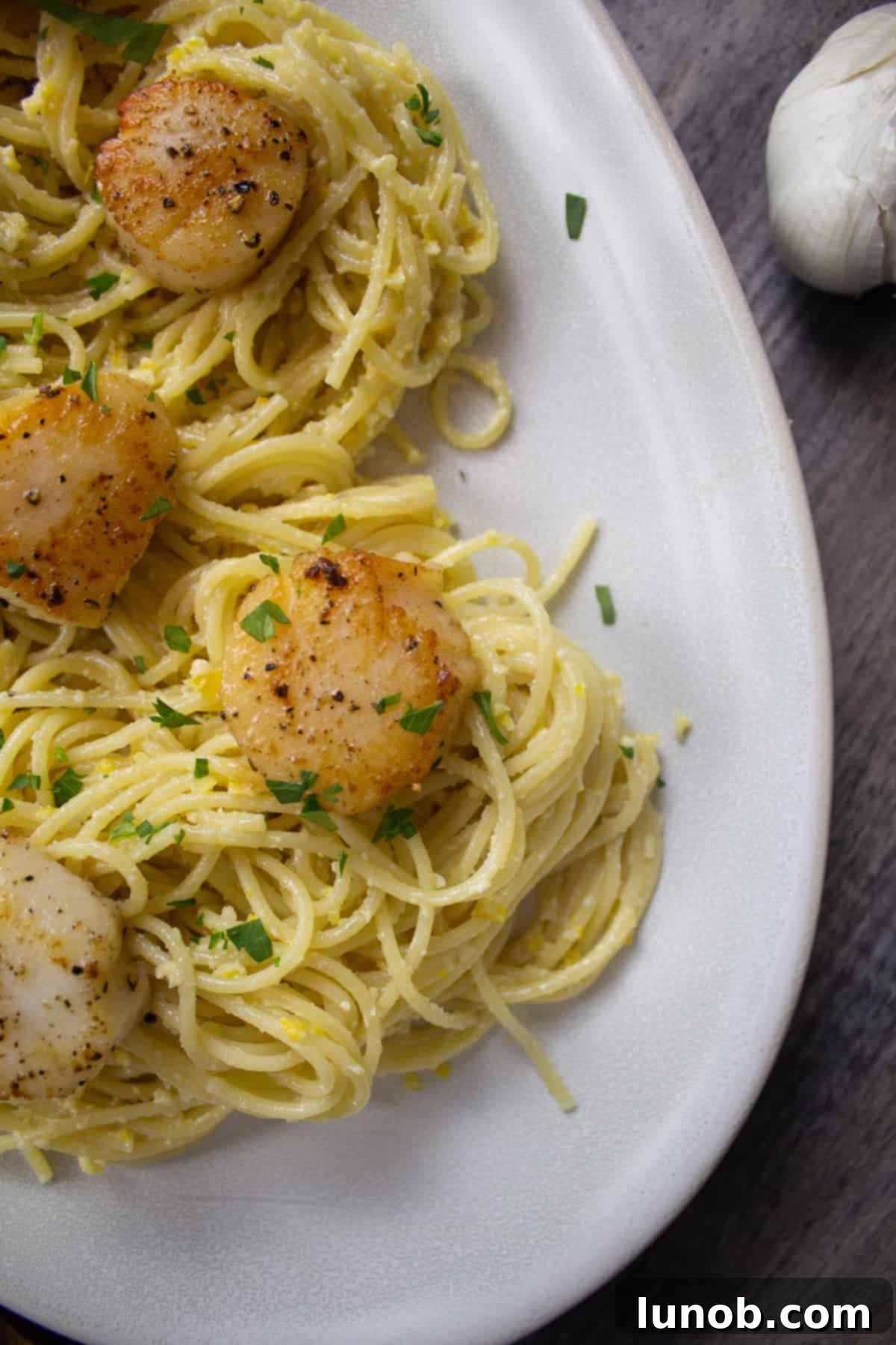 Lemon pesto spaghetti with scallops and fresh parsley
