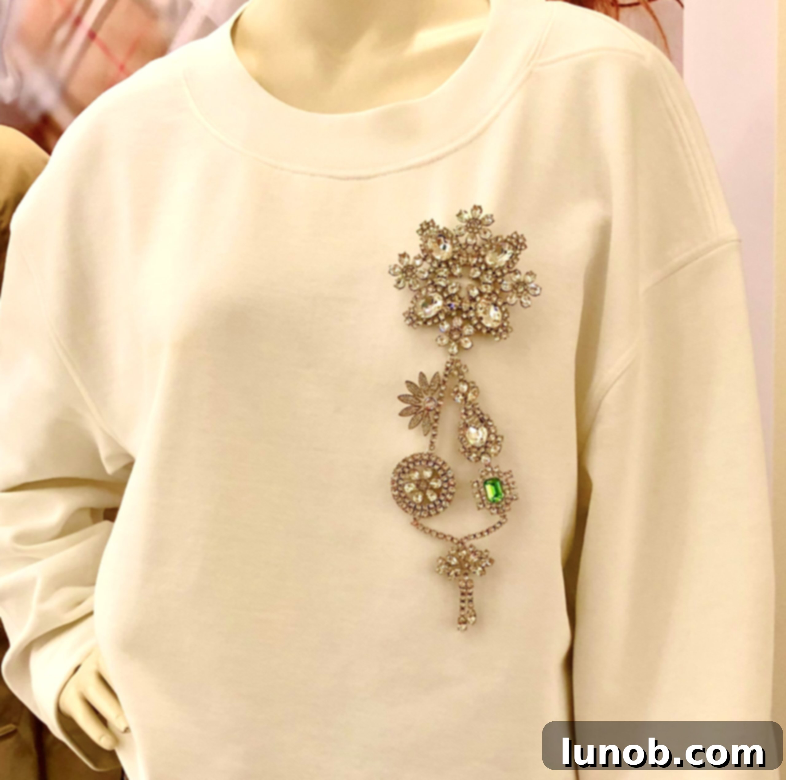 Outfit elevated by a stylish pin and a Burberry scarf in Verona