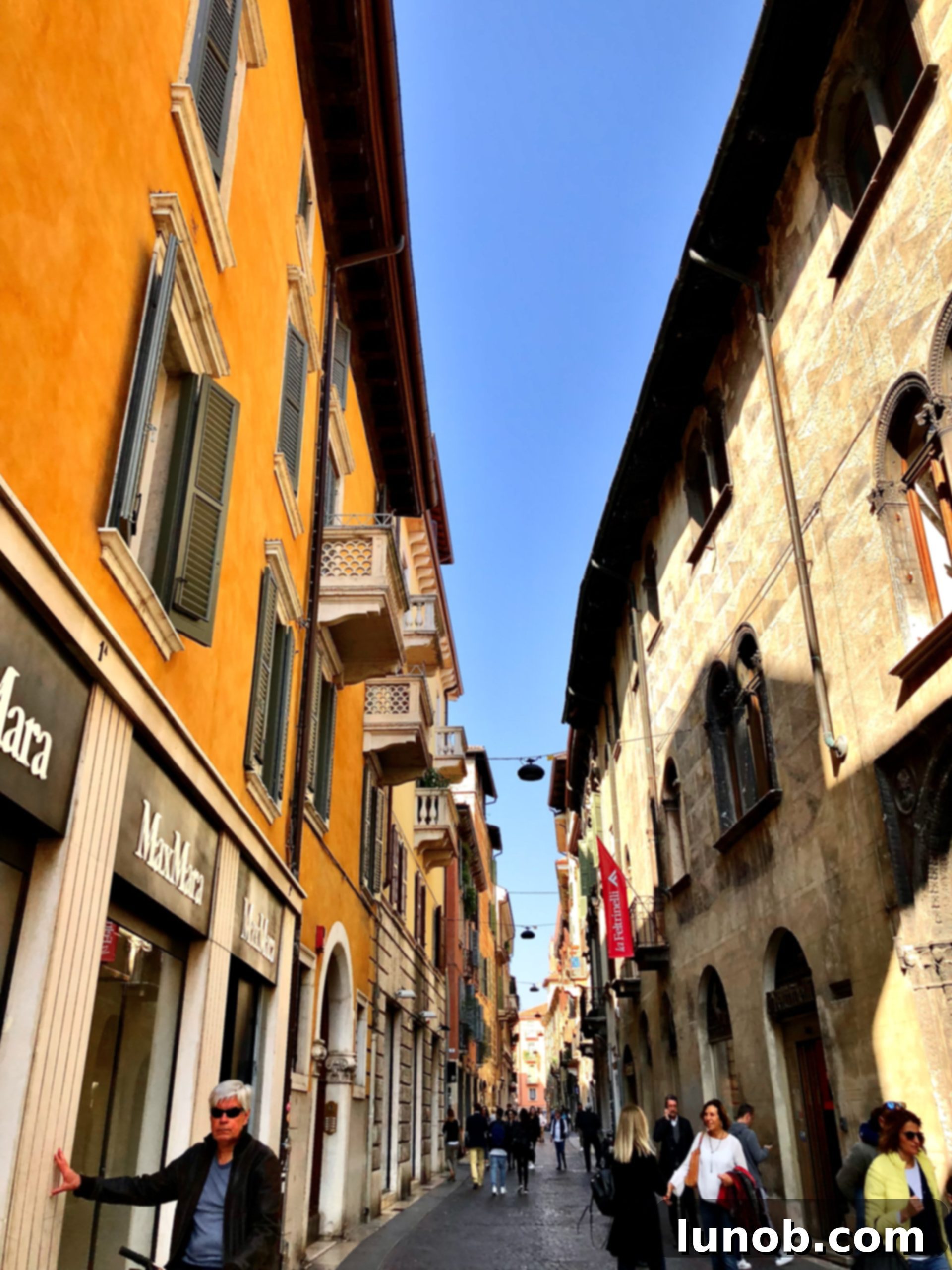 Bicycles parked on a car-less street in Verona, showcasing the city's pedestrian-friendly nature