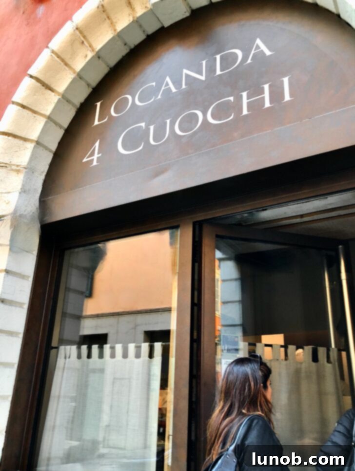 Open kitchen at Locanda 4 Cuochi, with chefs actively cooking