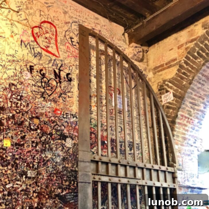 Graffiti and love notes covering the walls at the entrance to Juliet's courtyard
