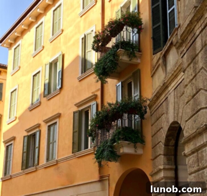 Verona's beautiful architecture featuring aged iron balconies, arches, and lush greenery