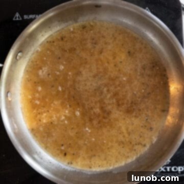 Pasta Alla Gricia: Rome's Simple Perfection 7 Adding starchy pasta water and black pepper to the rendered guanciale fat in the pan.