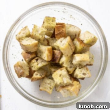 Crispy Homemade Parmesan Croutons 5 Bowl of chopped bread tossed in olive oil, garlic, and seasonings.