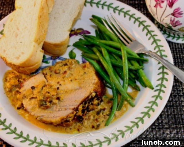 Italian Pork Loin Braised in Milk, slow-cooked to perfection in a rich, creamy garlic sauce. Discover this traditional Northern Italian recipe for an incredibly tender and flavorful pork roast.
