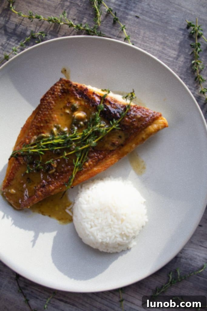 pan seared vermillion snapper topped with capers and thyme with rice pilaf