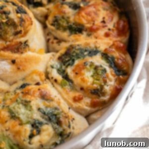 Golden brown veggie pinwheels baked in a cake pan, a perfect Italian appetizer.