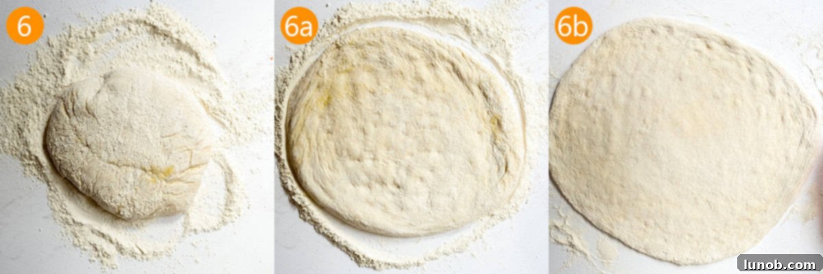 Pizza dough being rolled out evenly on a floured countertop.