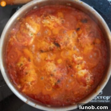 Chicken rollatini beautifully simmered in the rich, lightened tomato sauce.